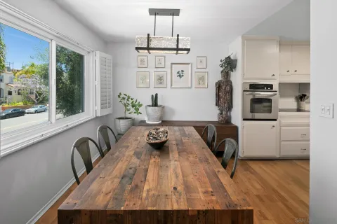 a living room with furniture fireplace and window