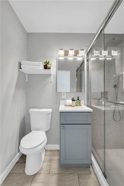 3910 Clairmont Road Atlanta, GA 30341 - Photo 20 of 23 a bathroom with a sink mirror toilet and shower