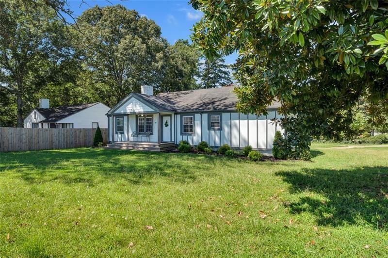 3910 Clairmont Road Atlanta, GA 30341 - Photo 21 of 23 a view of a house with a yard and sitting area