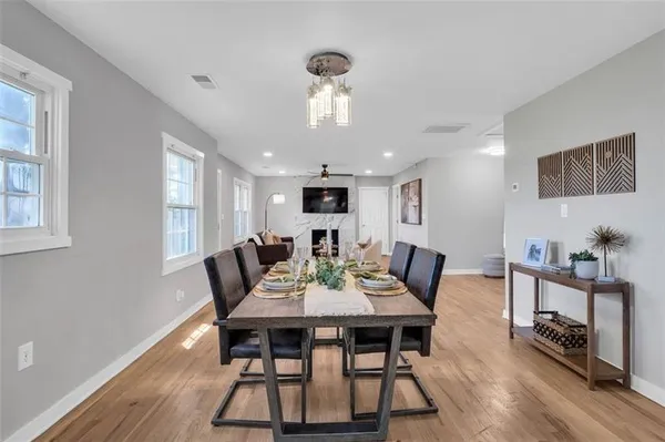 a view of a dining room with furniture window and wooden floor
