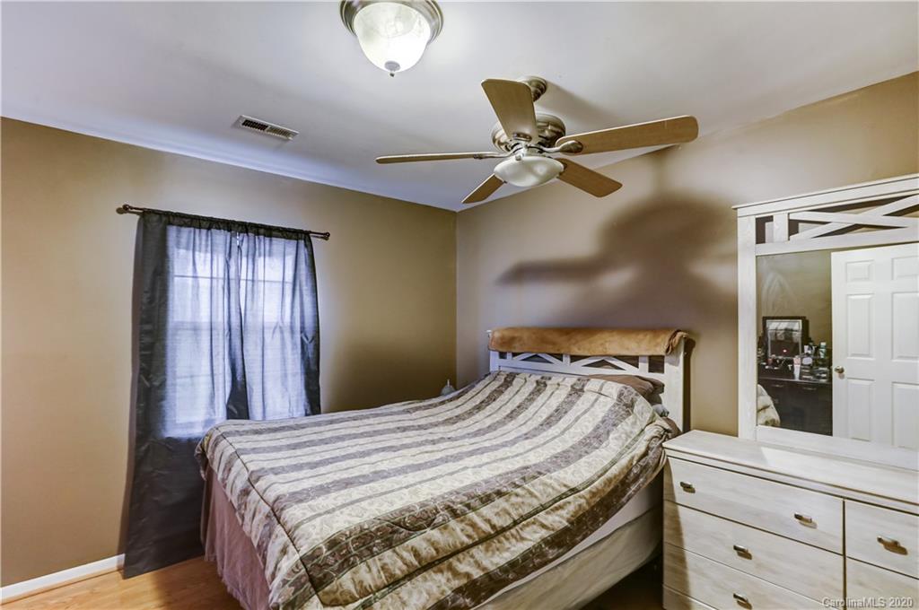 1024 Willis Farm Road Clover, SC 29710 - Photo 21 of 48 a bedroom with a bed and painting on the wall