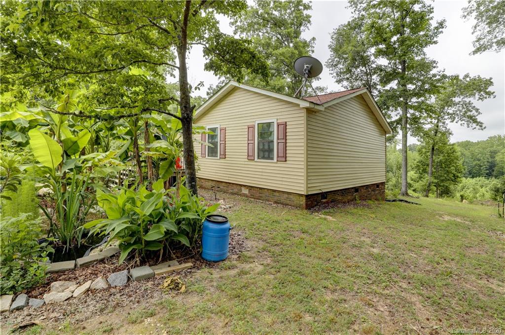 1024 Willis Farm Road Clover, SC 29710 - Photo 34 of 48 a view of a backyard with plants and large tree