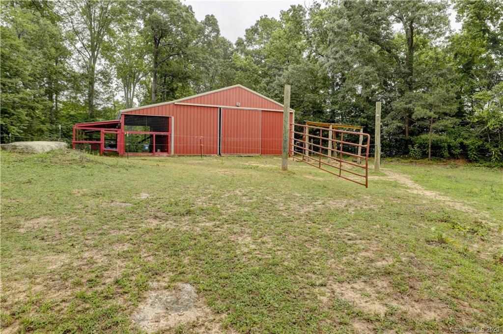1024 Willis Farm Road Clover, SC 29710 - Photo 42 of 48 a backyard of a house with table and chairs