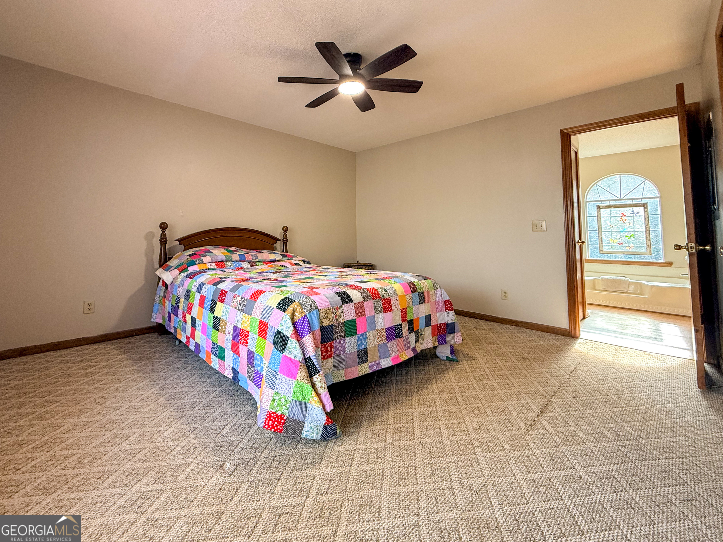 354 Prairie Flower Drive Cleveland, GA 30528 - Photo 18 of 49 a bedroom with a bed and a ceiling fan