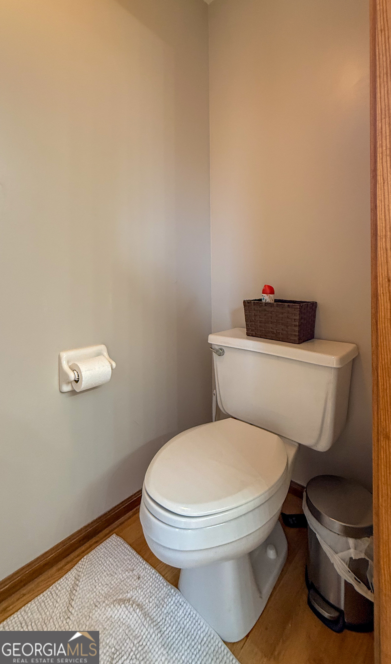 354 Prairie Flower Drive Cleveland, GA 30528 - Photo 23 of 49 a white toilet sitting next to a bathroom sink and vanity