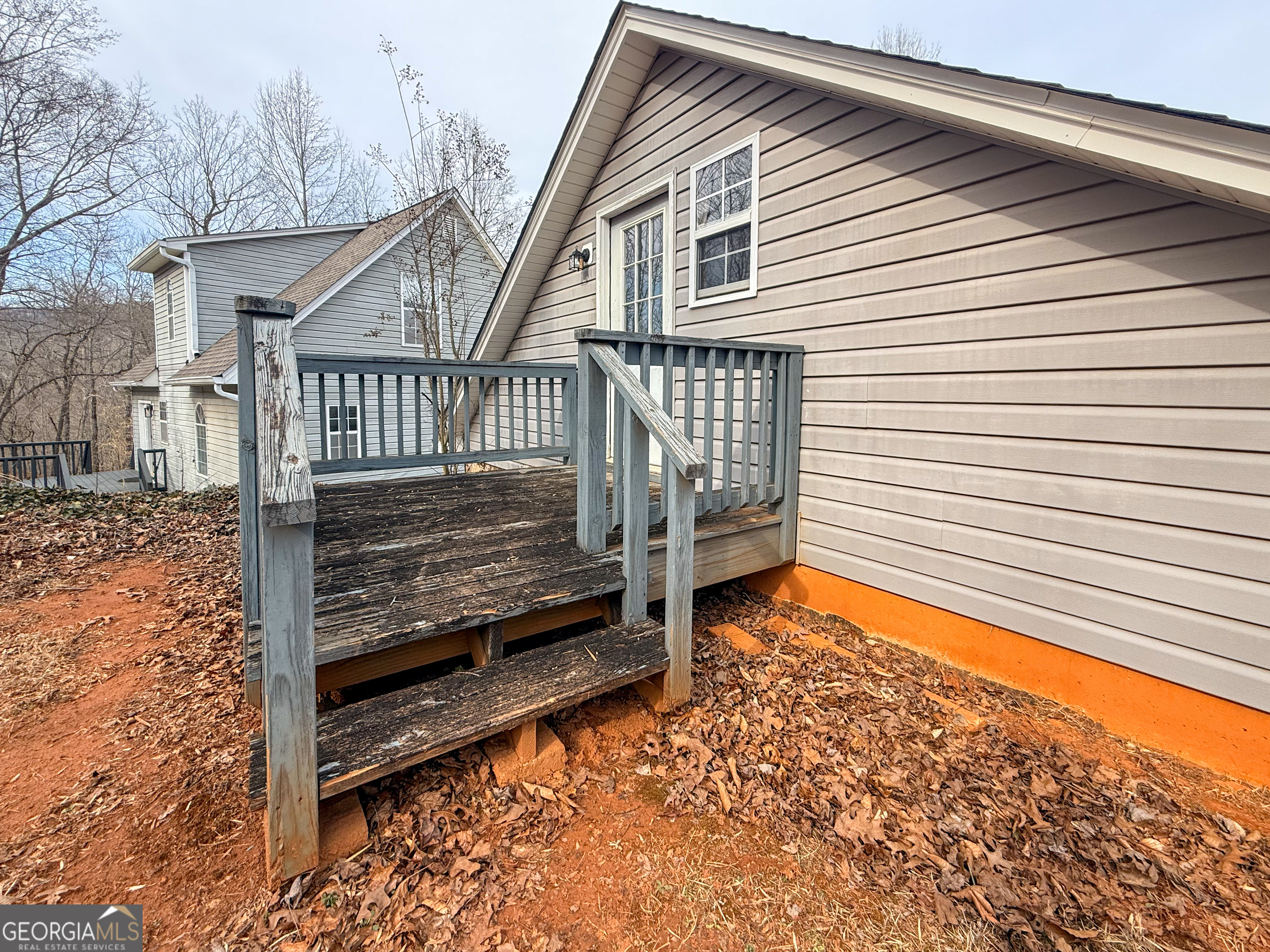 354 Prairie Flower Drive Cleveland, GA 30528 - Photo 36 of 49 a view of a house with a small deck and wooden floor