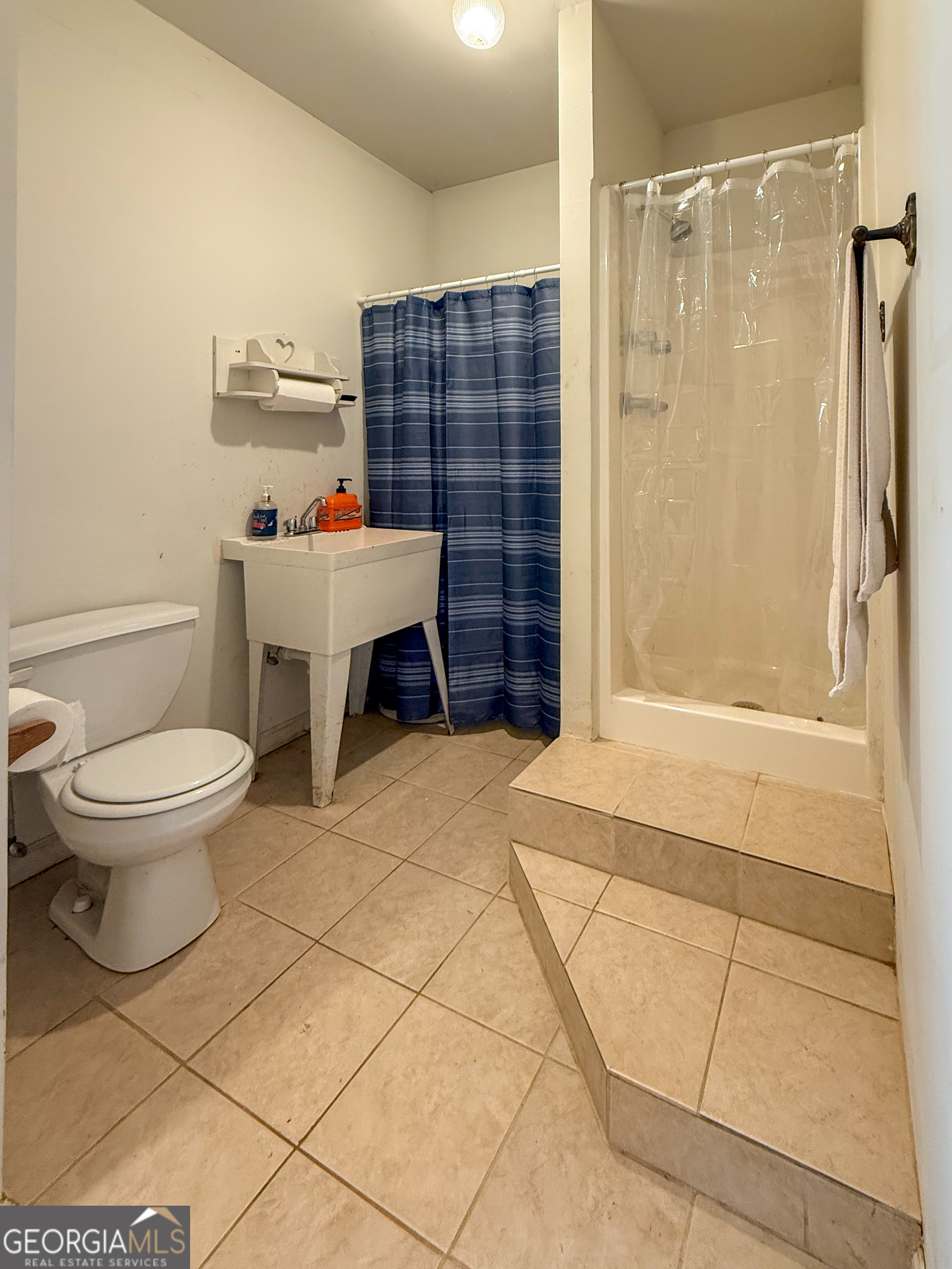 354 Prairie Flower Drive Cleveland, GA 30528 - Photo 41 of 49 a bathroom with a toilet and a shower