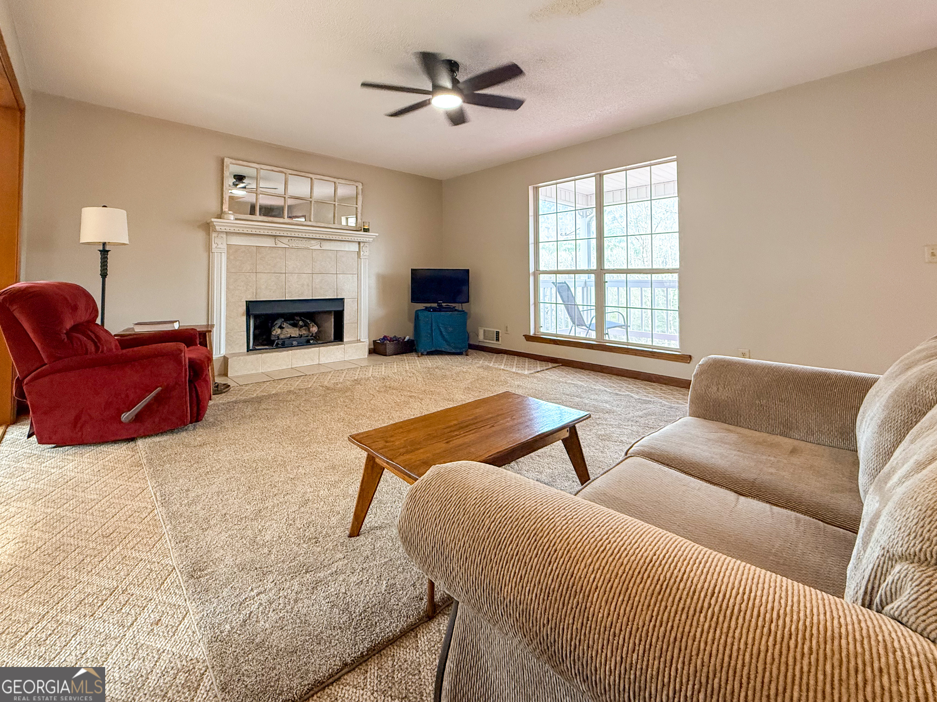 354 Prairie Flower Drive Cleveland, GA 30528 - Photo 10 of 49 a living room with furniture and a fireplace