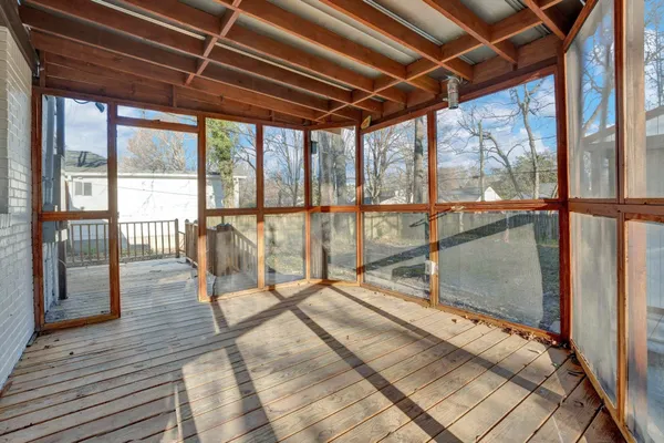 a view of a house with wooden fence