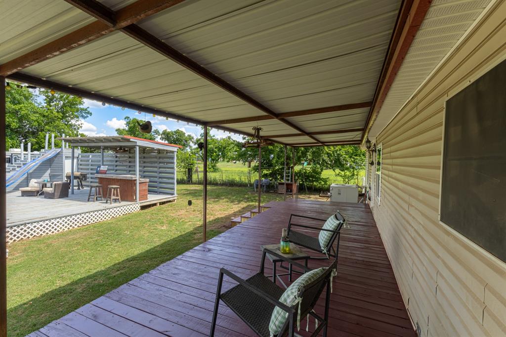75 Southern Road Mineral Wells, TX 76067 - Photo 29 of 31 a view of a backyard with sitting area