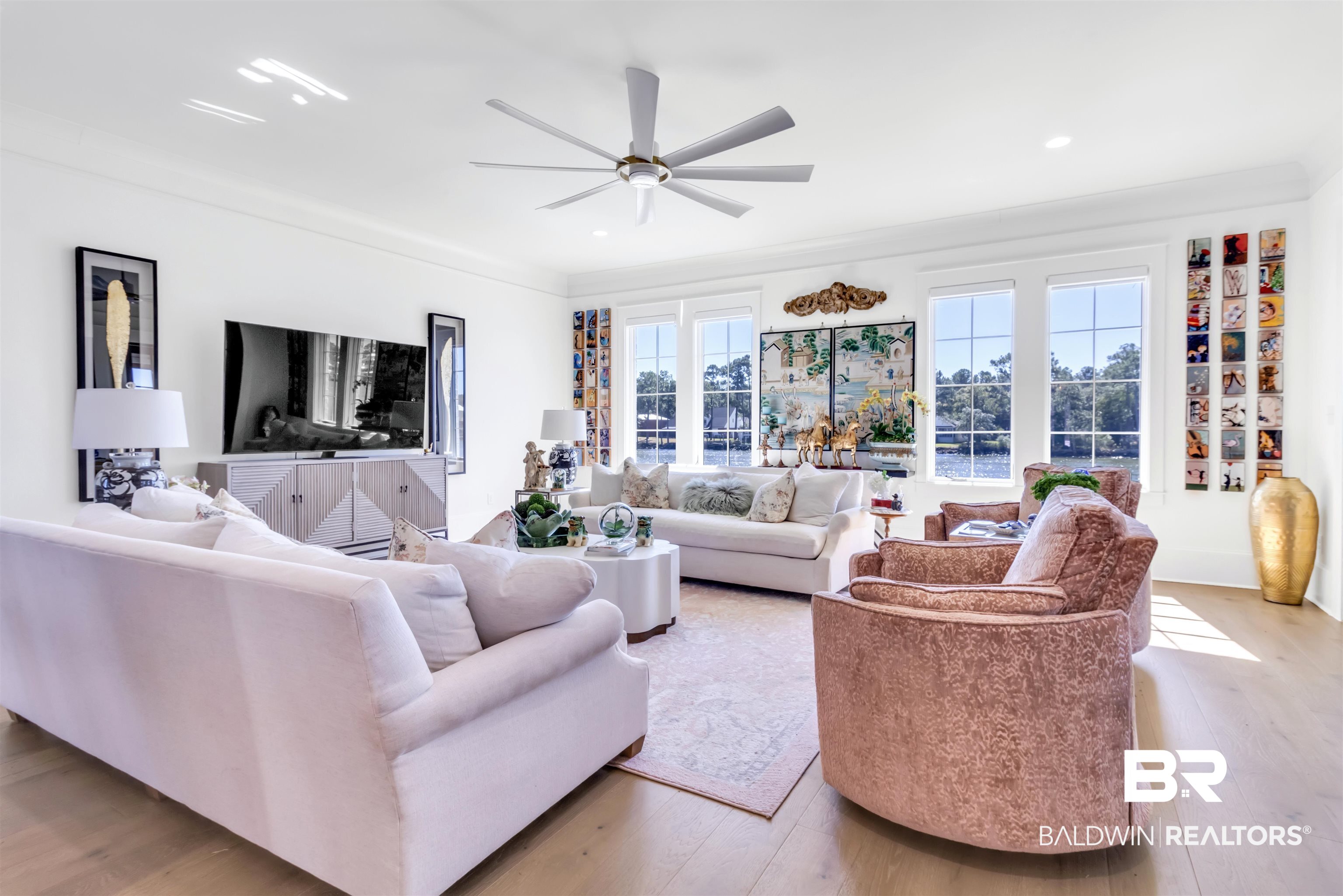 885 Inlet Circle Gulf Shores, AL 36542 - Photo 15 of 36 Living room with ceiling fan, ornamental molding, and light wood-type flooring
