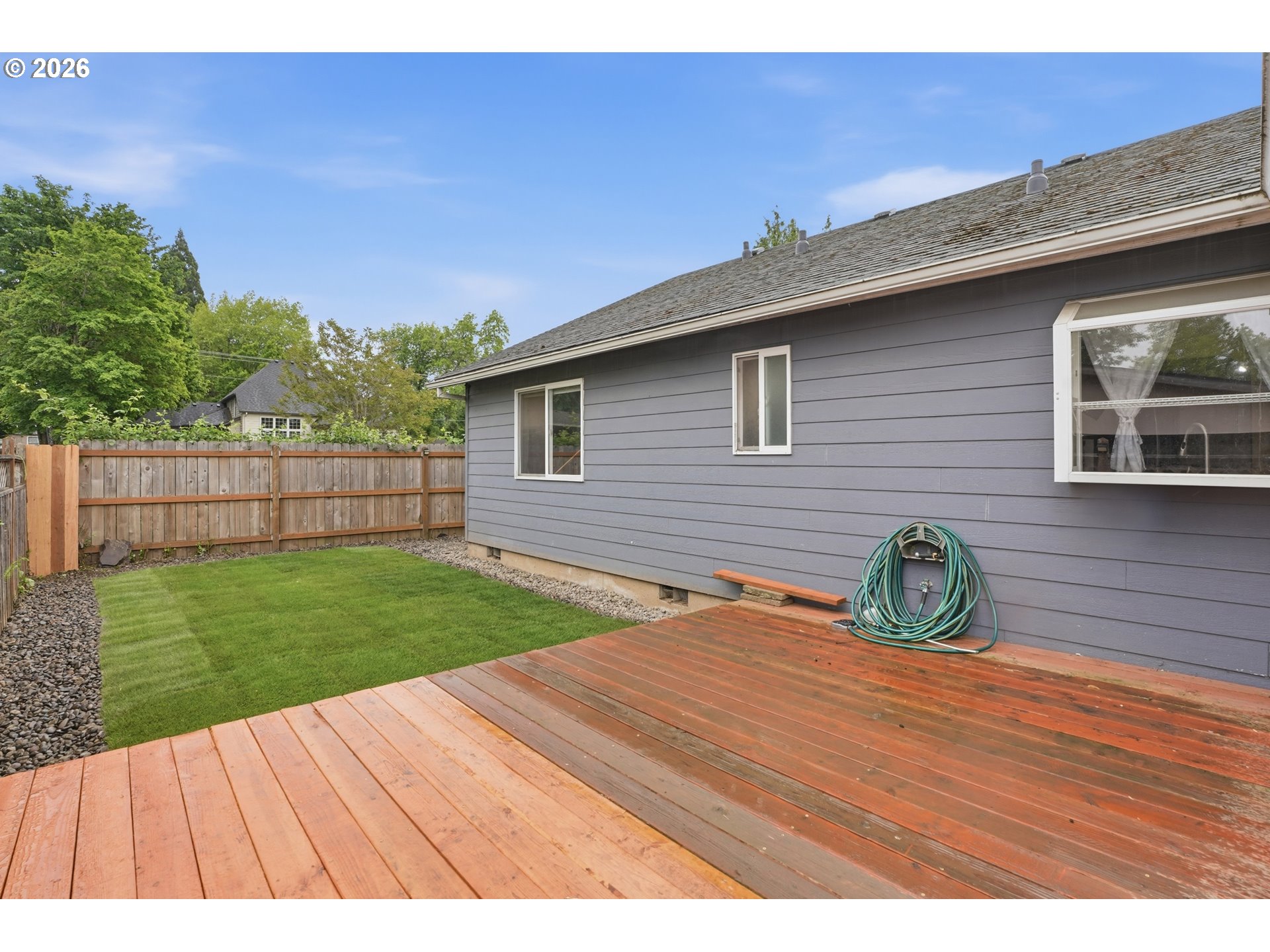 105 Toliver Road Molalla, OR 97038 - Photo 24 of 34 a backyard of a house with wooden floor and fence