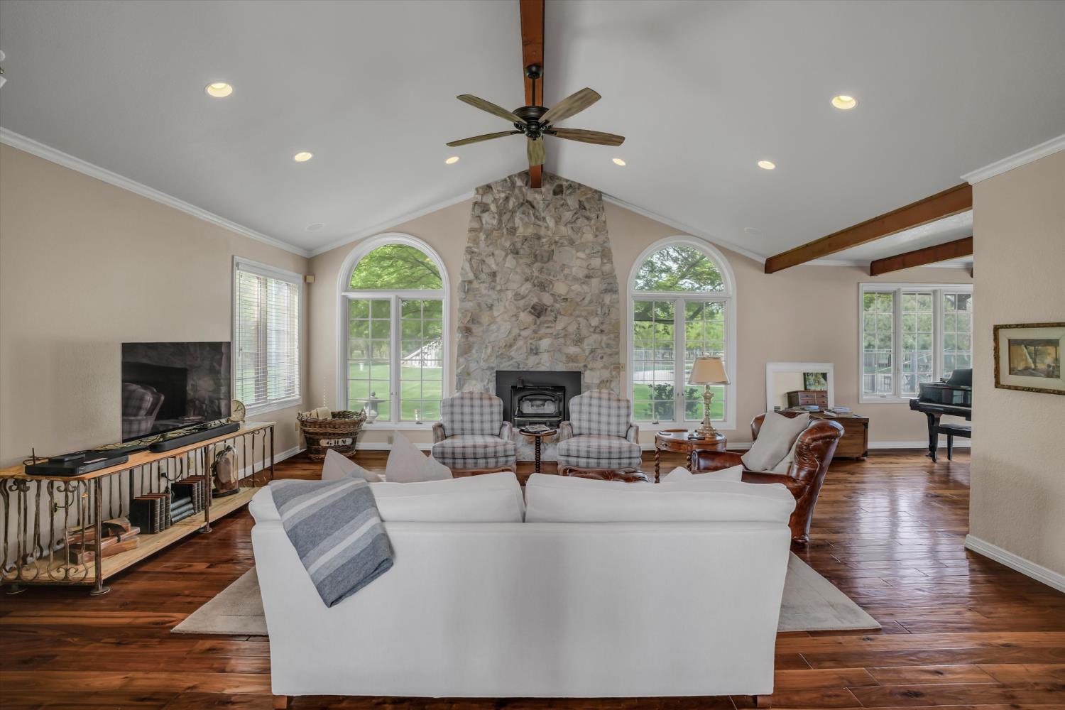 17230 Franscella Lane Ripon, CA 95366 - Photo 11 of 50 a living room with fireplace furniture and a flat screen tv