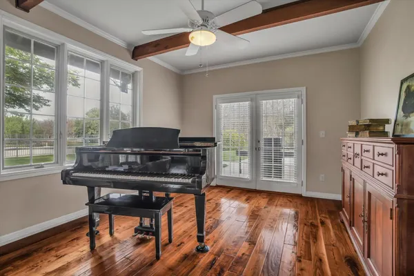 a work room with furniture and wooden floor