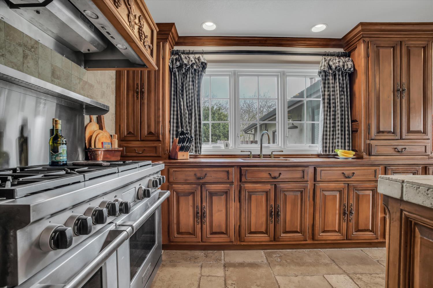 17230 Franscella Lane Ripon, CA 95366 - Photo 19 of 50 a kitchen with granite countertop a stove and a sink