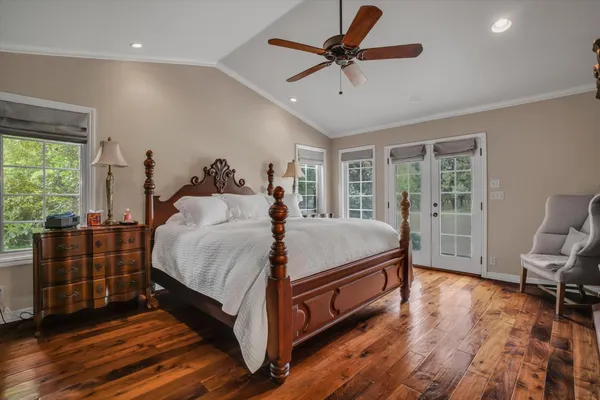 a bed room with a bed and a chandelier