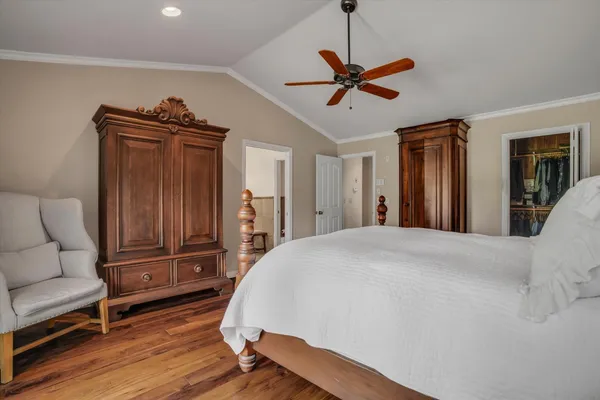 a bed room with a bed and a television