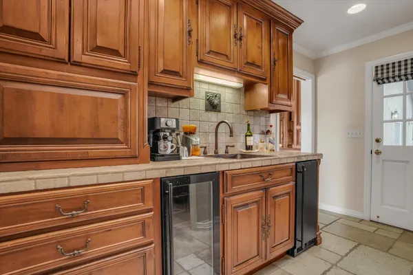 a kitchen with stainless steel appliances granite countertop a sink and cabinets