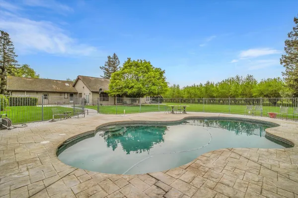 a view of a swimming pool with a lake view