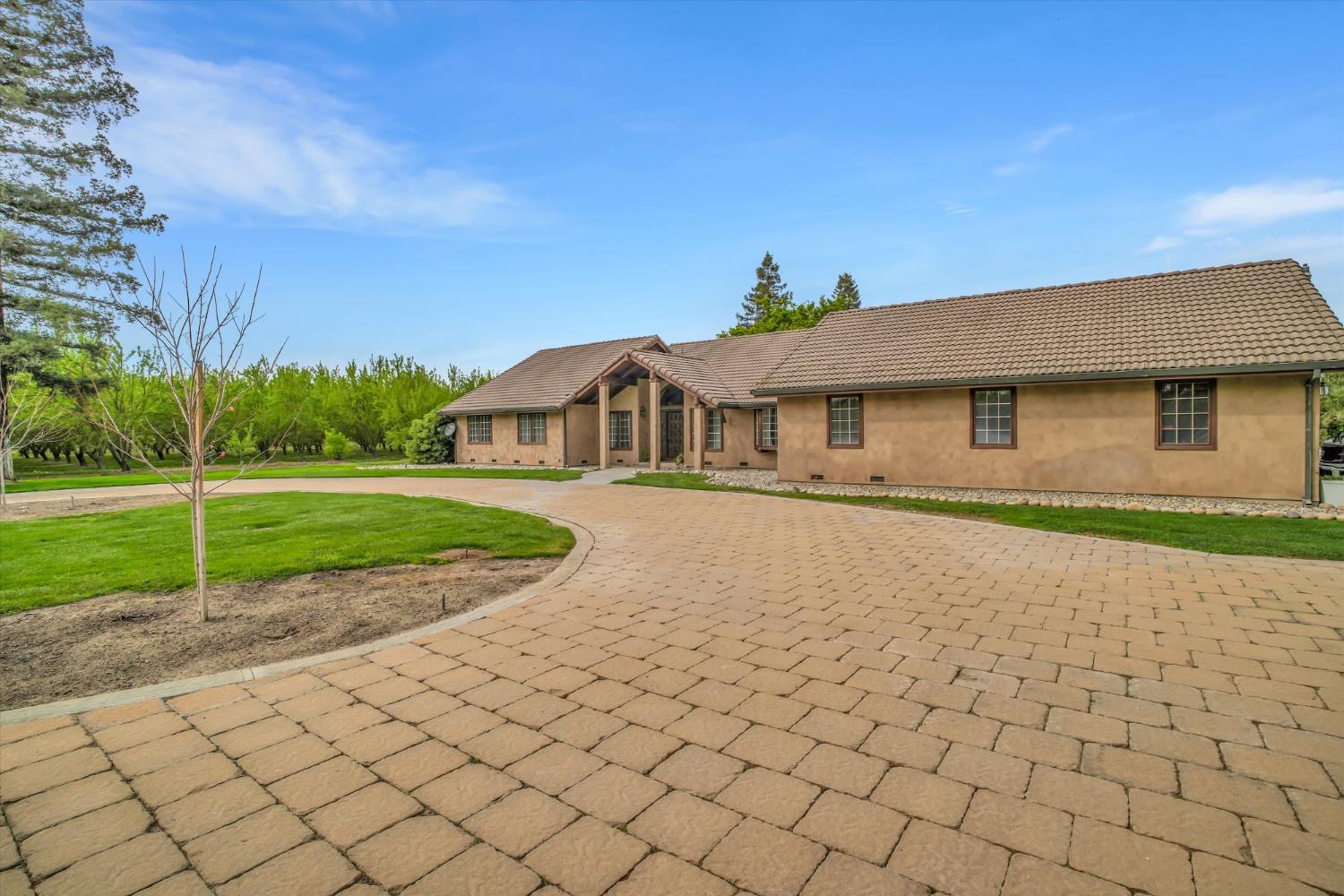 17230 Franscella Lane Ripon, CA 95366 - Photo 5 of 50 a house with green field in front of it