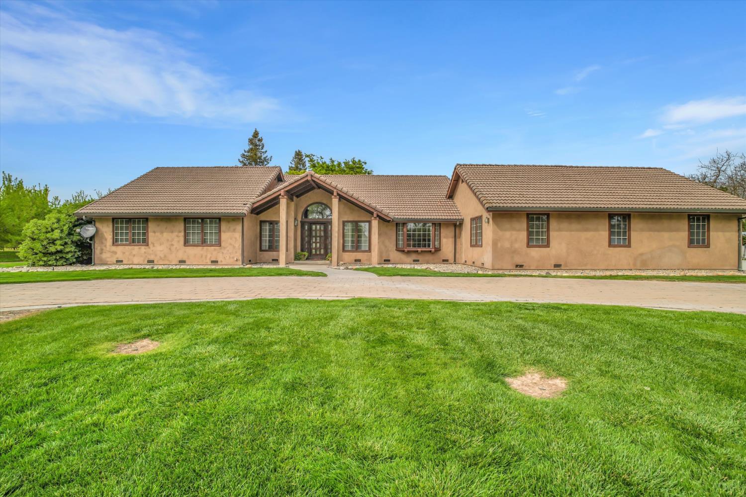 17230 Franscella Lane Ripon, CA 95366 - Photo 9 of 50 a front view of a house with a yard