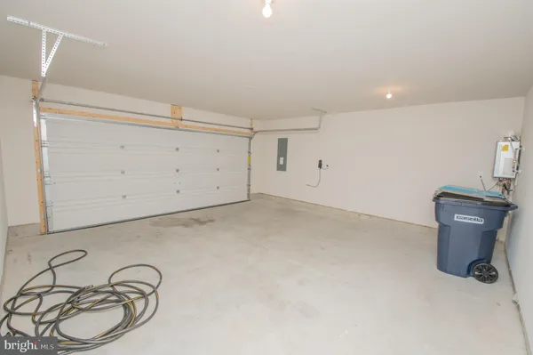 a view of a storage & utility room with racks on the wall