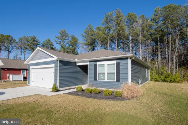 a house with trees in the background