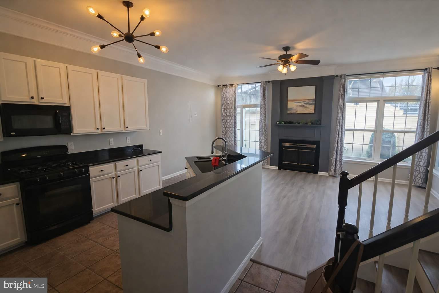 43068 Eustis Street Chantilly, VA 20152 - Photo 5 of 25 a kitchen with a sink appliances and cabinets