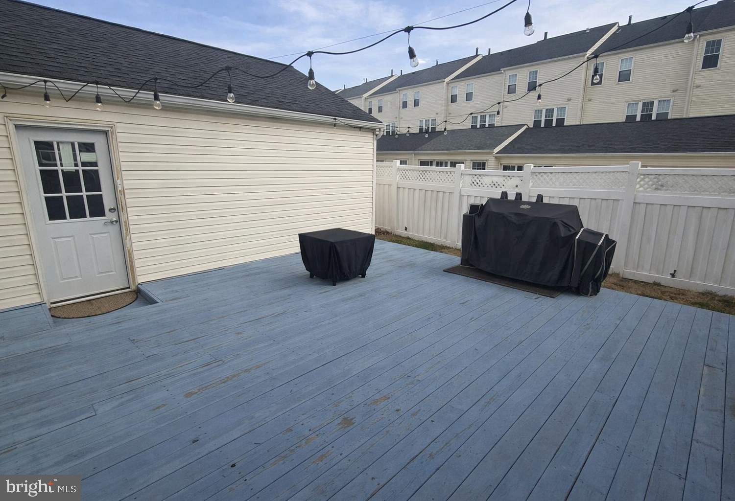 43068 Eustis Street Chantilly, VA 20152 - Photo 7 of 25 a room with wooden floor and furniture