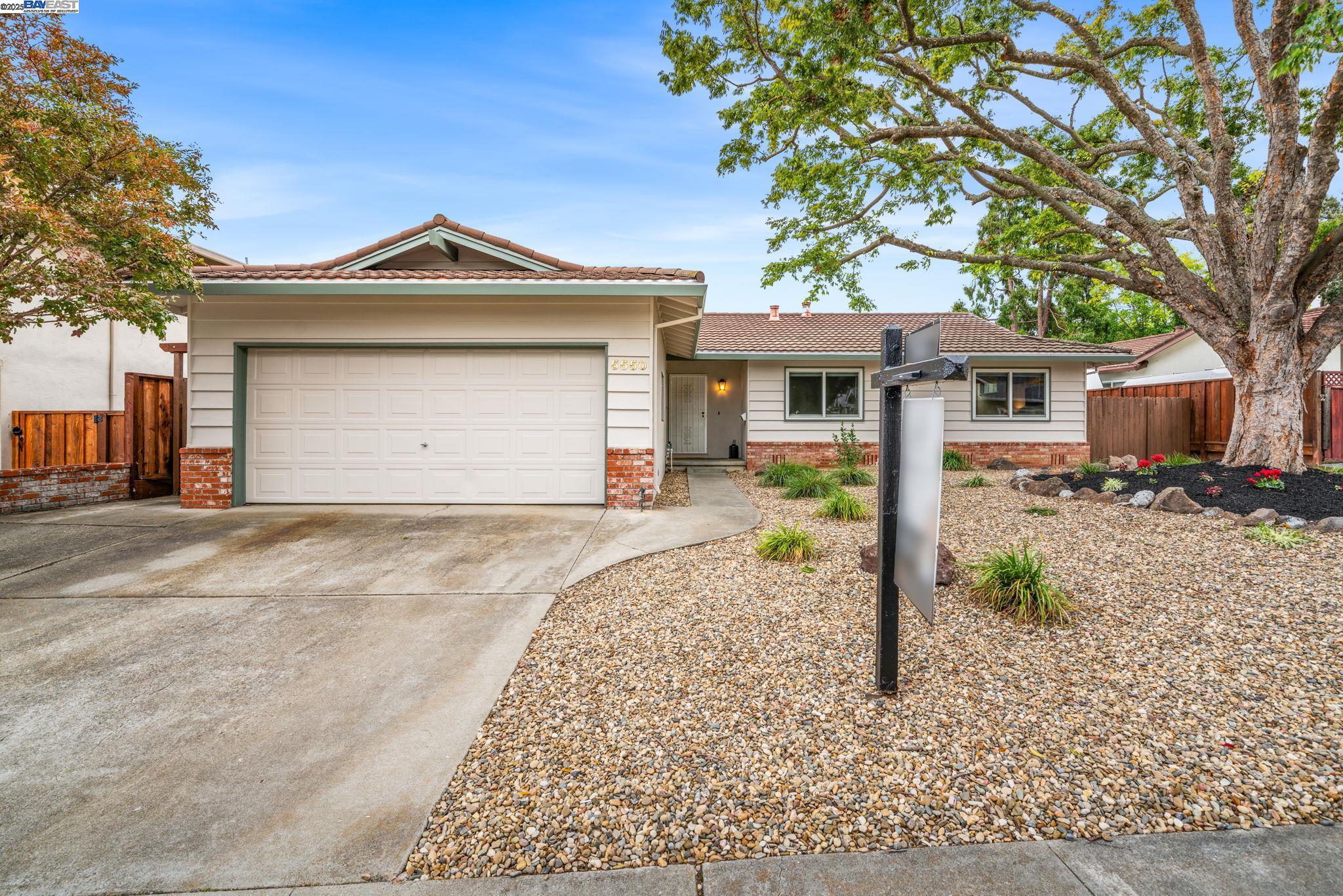 5550 San Juan Way Pleasanton, CA 94566 - Photo 1 of 1 a front view of a house with a yard and garage