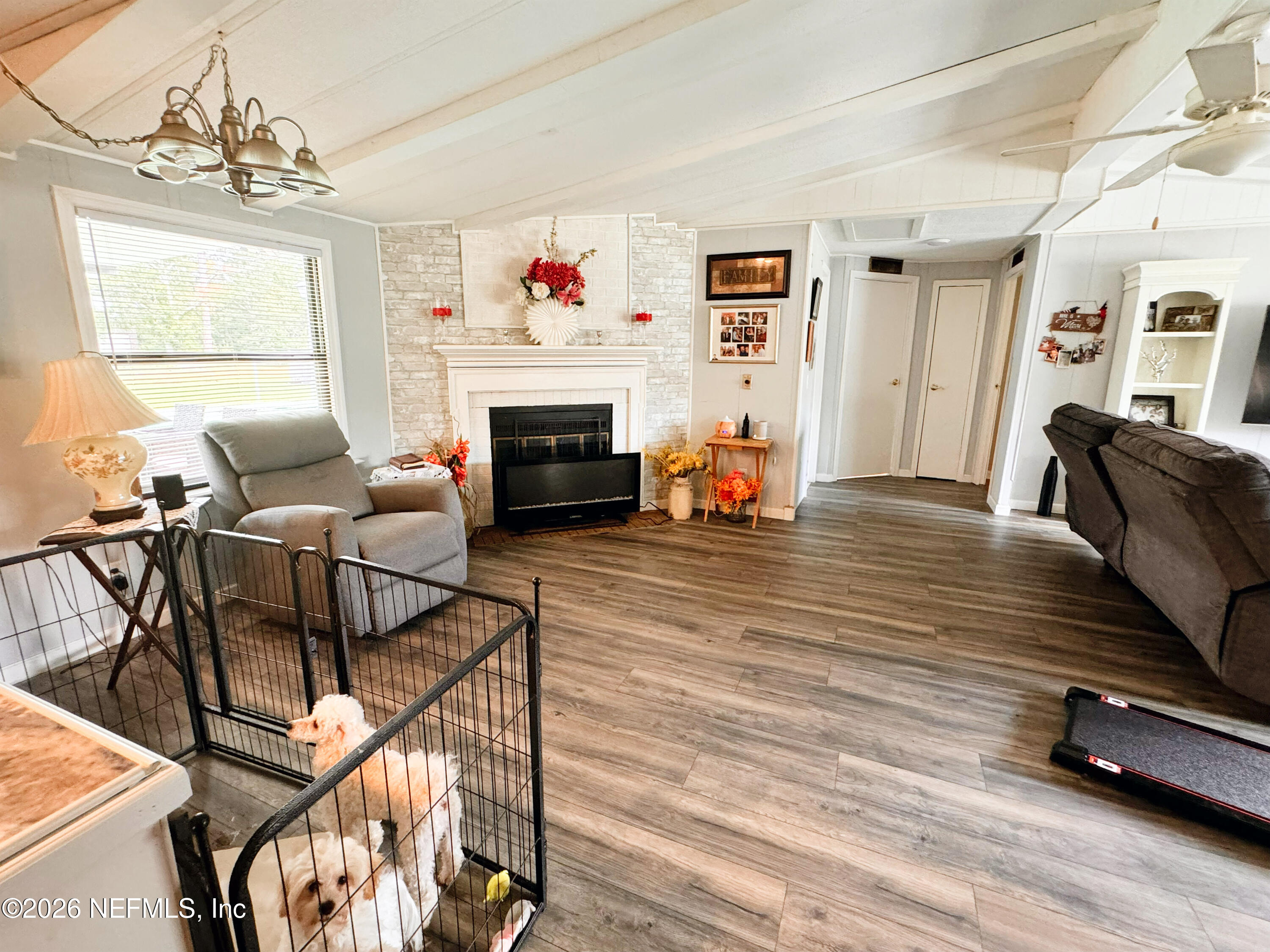 140 Keystone Road Palatka, FL 32177 - Photo 19 of 19 a living room with furniture and a fireplace
