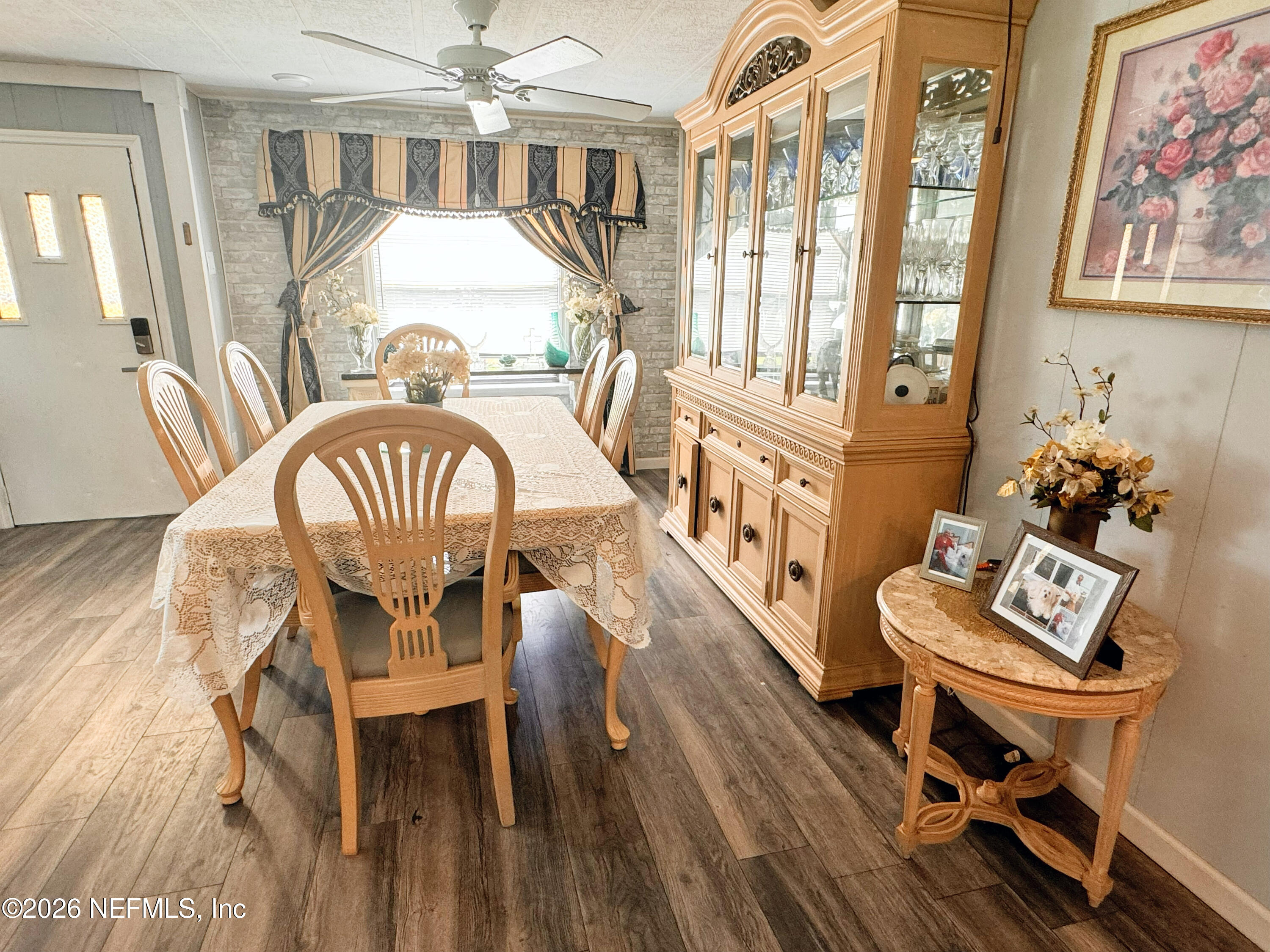 140 Keystone Road Palatka, FL 32177 - Photo 8 of 19 a view of a dining room with furniture a chandelier and wooden floor
