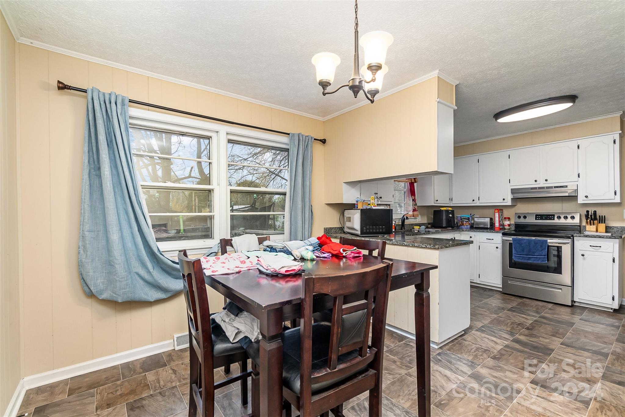 501 Weaver Street Cherryville, NC 28021 - Photo 12 of 26 a view of a dining room with furniture window and outside view