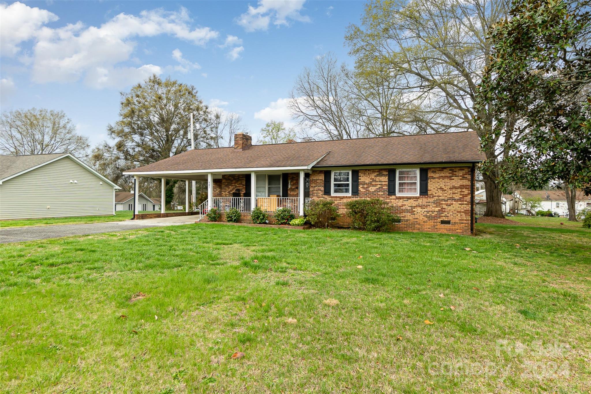 501 Weaver Street Cherryville, NC 28021 - Photo 2 of 26 a view of a house with a backyard