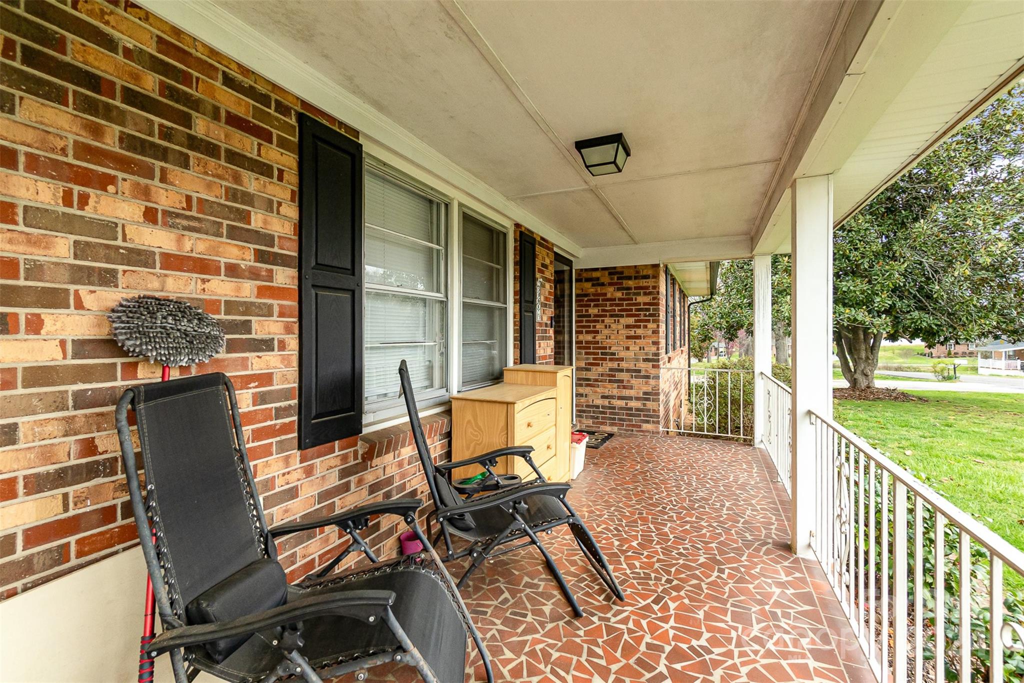 501 Weaver Street Cherryville, NC 28021 - Photo 5 of 26 a balcony with furniture and a garden