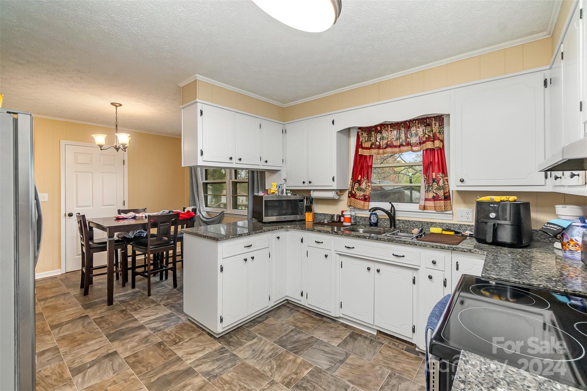 501 Weaver Street Cherryville, NC 28021 - Photo 10 of 26 a kitchen that has a lot of cabinets in it and appliances