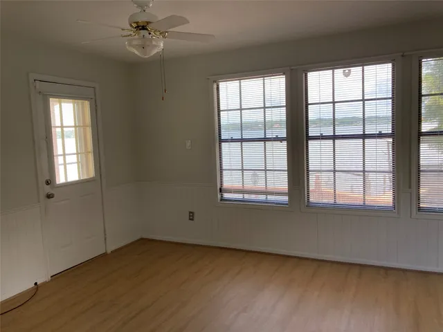 a view of living room with furniture and a fireplace