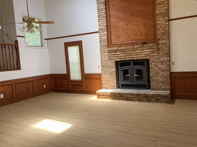 a view of an entryway with wooden floor