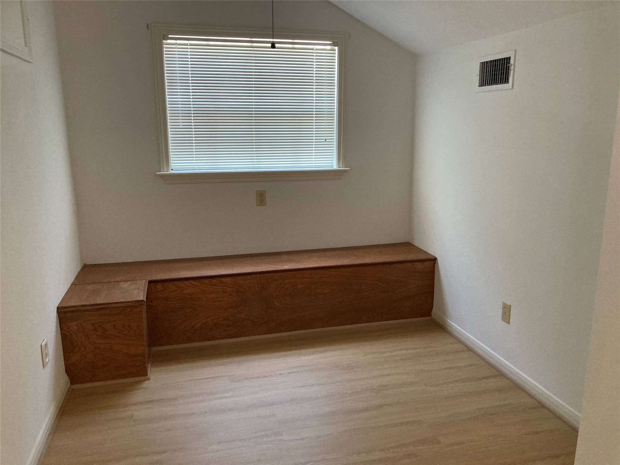 554 Harbor Drive Onalaska, TX 77360 - Photo 28 of 32 an empty room with wooden floor and windows