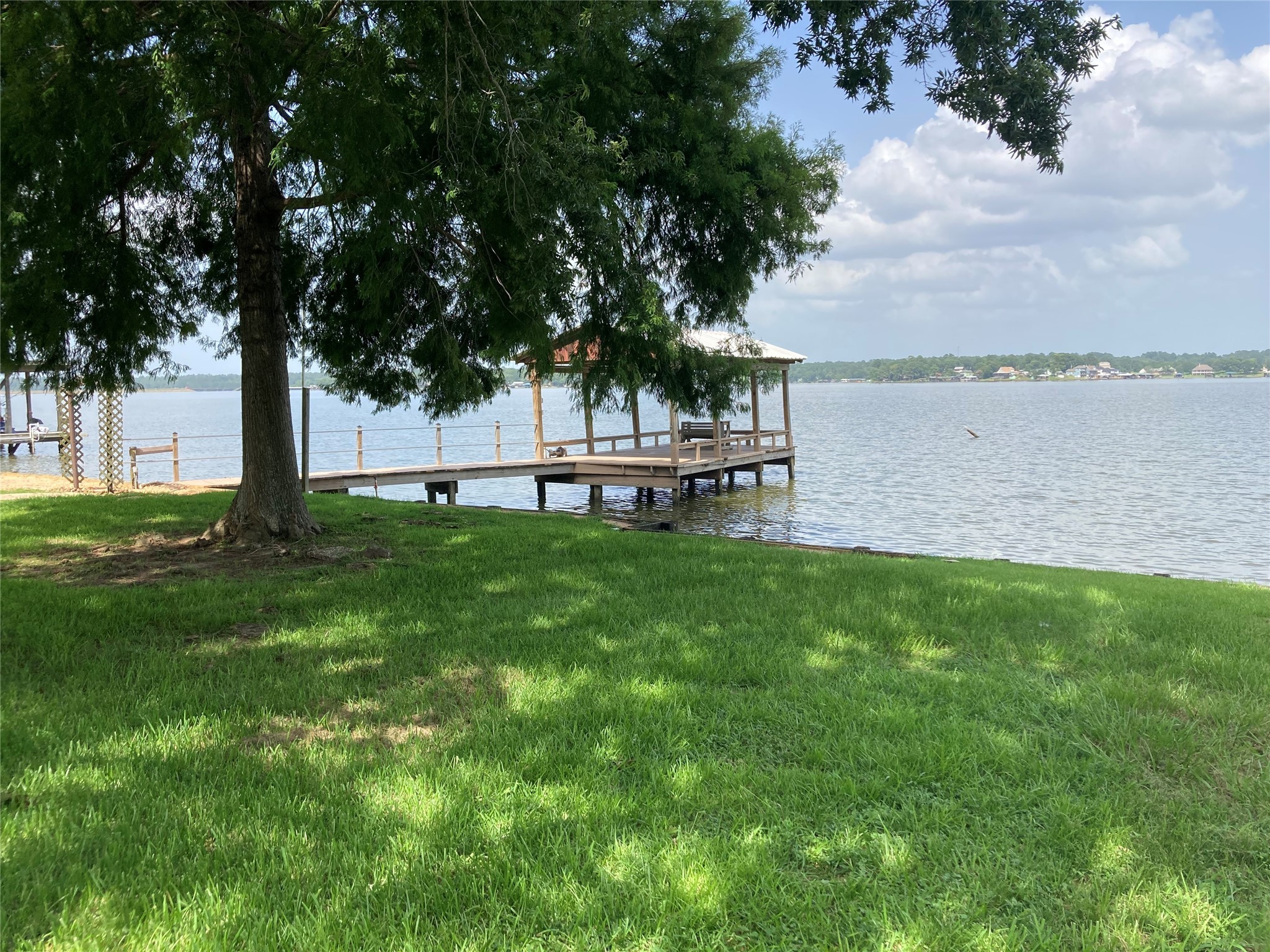 554 Harbor Drive Onalaska, TX 77360 - Photo 5 of 32 a view of a house with a yard and sitting area