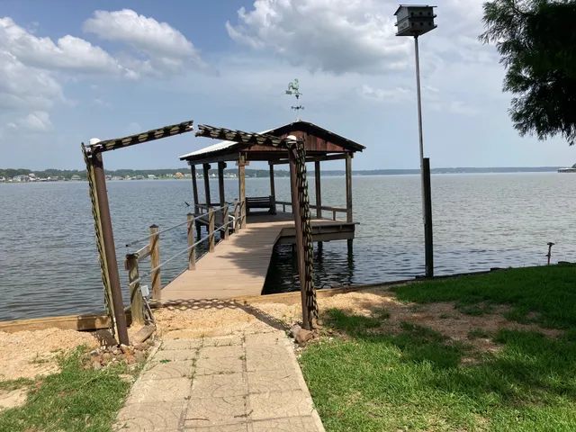 a view of a wooden deck with a bench