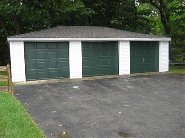 114 River Road Merrimac, MA 01860 - Photo 29 of 30 a front view of a house with a garage