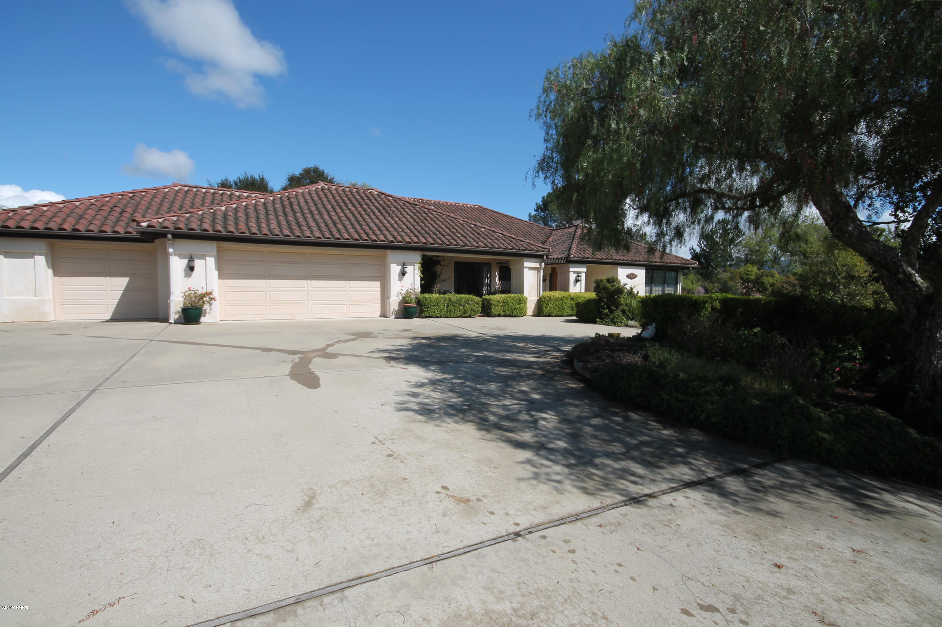 1553 Aalborg Way Solvang, CA 93463 - Photo 2 of 12 a view of a white house with a yard
