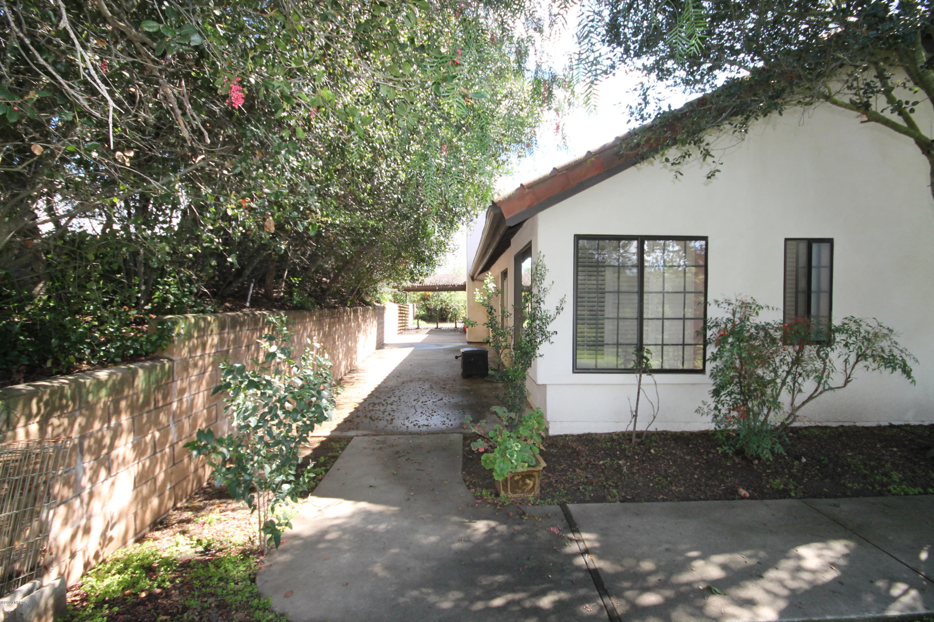 1553 Aalborg Way Solvang, CA 93463 - Photo 3 of 12 a front view of a house with a yard and tree s