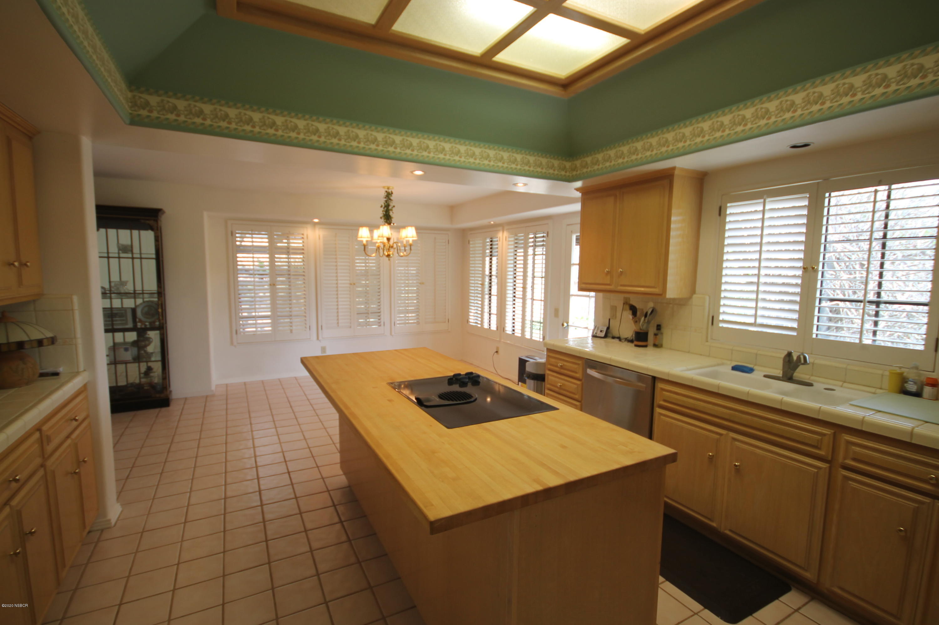 1553 Aalborg Way Solvang, CA 93463 - Photo 7 of 12 a kitchen with a sink and cabinets