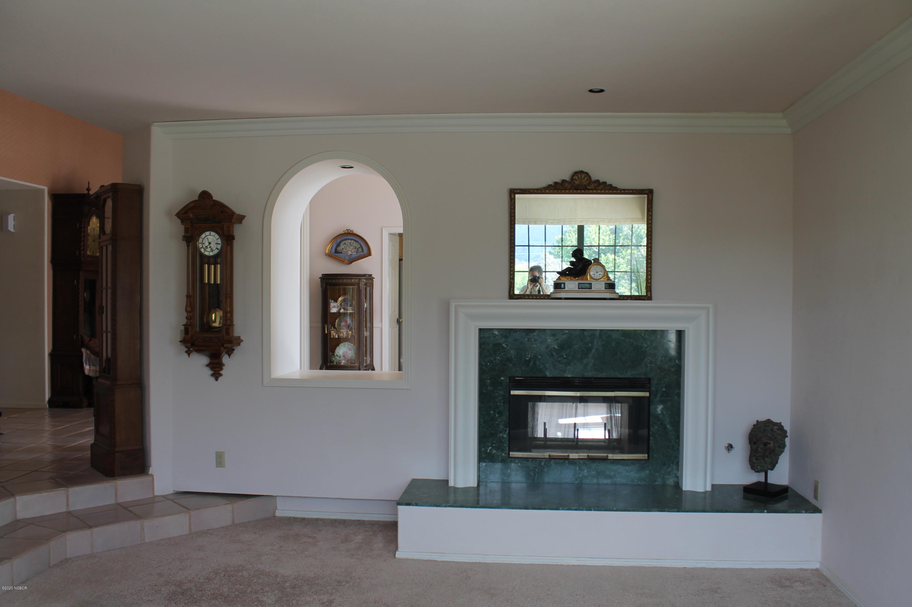 1553 Aalborg Way Solvang, CA 93463 - Photo 10 of 12 a living room with a fireplace and a window