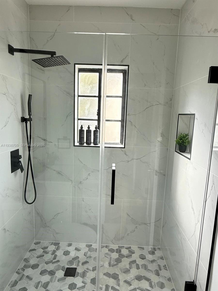 864 80th Street, Unit 1 Miami Beach, FL 33141 - Photo 12 of 13 a bathroom with a shower