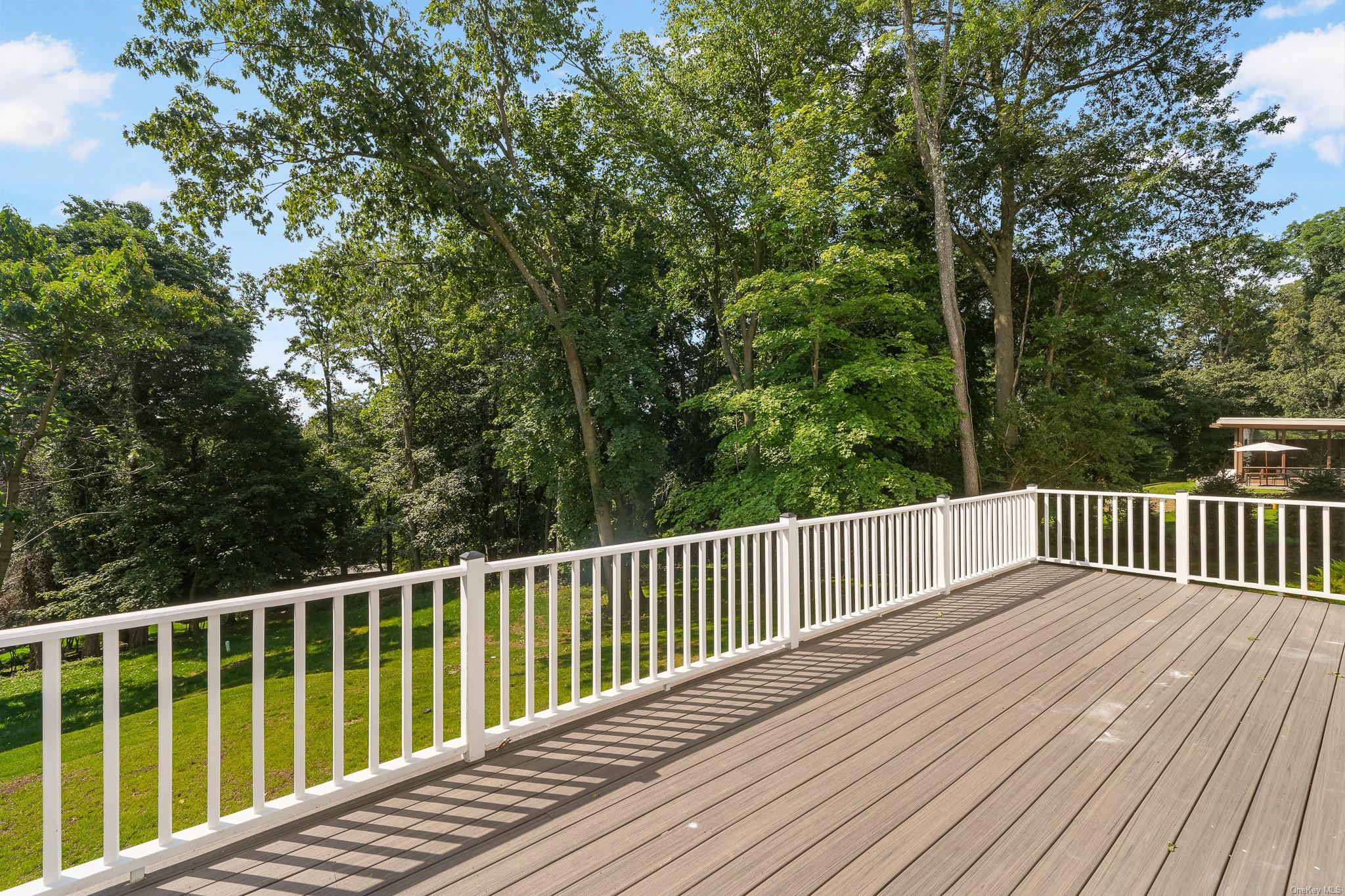 47 Laurel Lane Locust Valley, NY 11560 - Photo 35 of 39 Deck featuring a yard