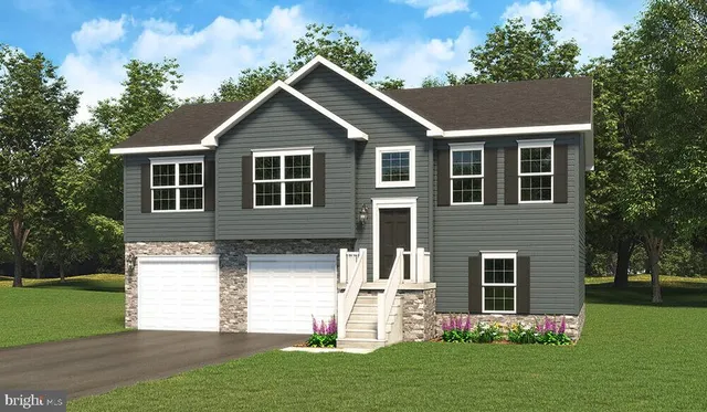 a front view of a house with a garden and plants