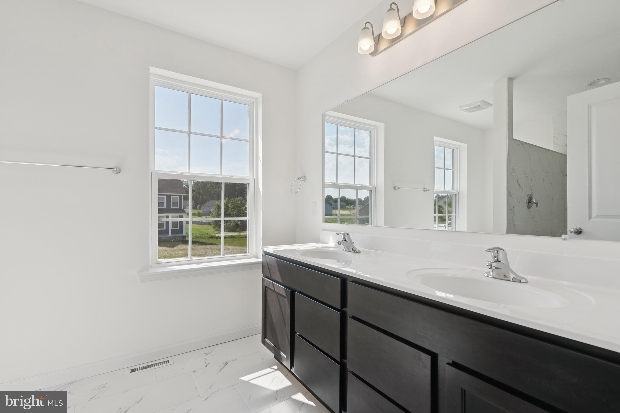 625 Ripple Drive, Unit 187 Hanover, PA 17331 - Photo 13 of 20 a bathroom with a sink and a window